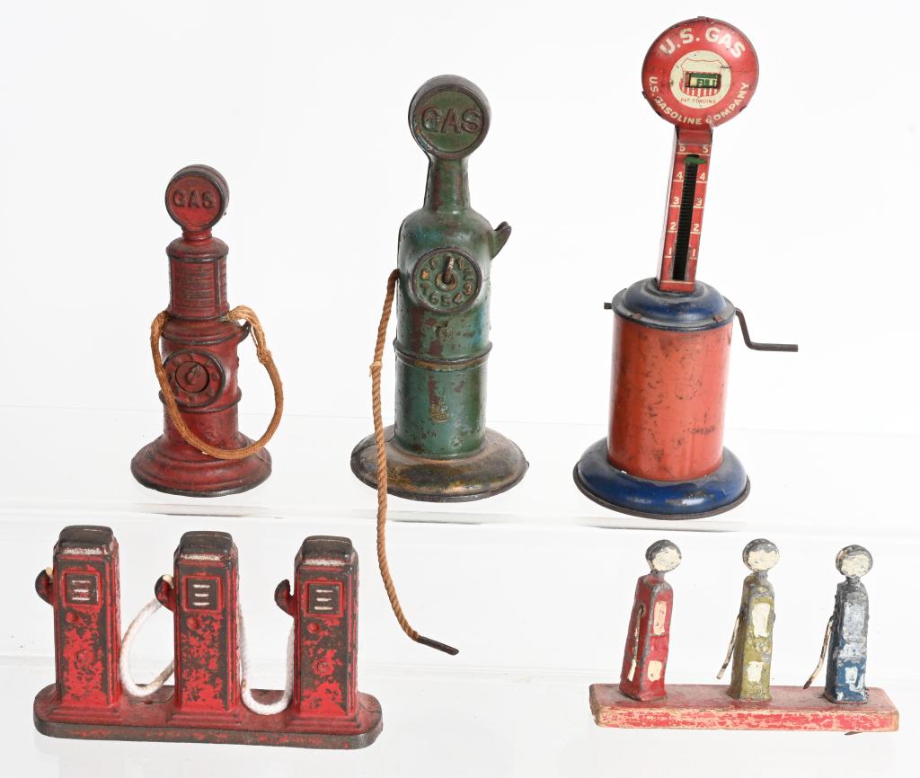 CAST IRON & TIN TOY GAS PUMPS: Includes 2 Arcade cast iron Clockface Gas Pumps, Set of 3 cast iron Pumps, Tin US Gas Pump, and More Largest 7" Very Good