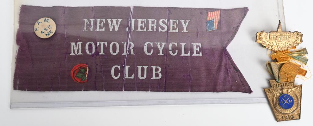 1910 F.A.M. MOTORCYCLE MEDAL, PIN, & N.J. PENNANT: Lot include rare 1910 Philadelphia F.A.M. medal, a F.A.M. "ask Me" pinback button and an early silk New Jersey Motorcycle club 9" pennant. The Federation of American Motorcyclists (F.A.M.) was founded