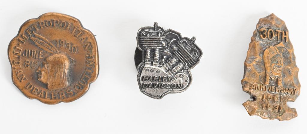 3- INDIAN & HARLEY-DAVIDSON MOTORCYCLE PINS: Lot includes a Harley-Davidson Twin lapel button, a 1930 Indian Dealers Outing pin, along with a 1931 Indian 30th anniversary pin. Largest is 1". Excellent