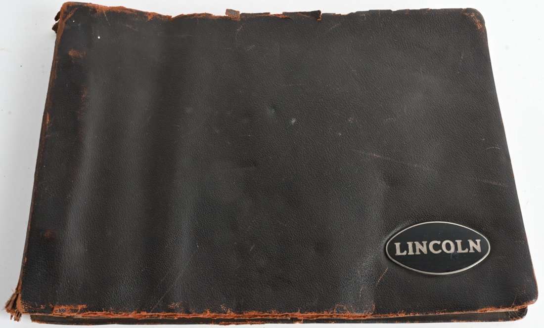 1930 LINCOLN LEATHER BOUND DEALER PHOTO ALBUM: Great early dealer album with 21 photos of 1930 Lincoln auto models. the photos are bound in leather and there is a enameled metal Lincoln radiator badge afixed to the cover. Has general wear. Very Go