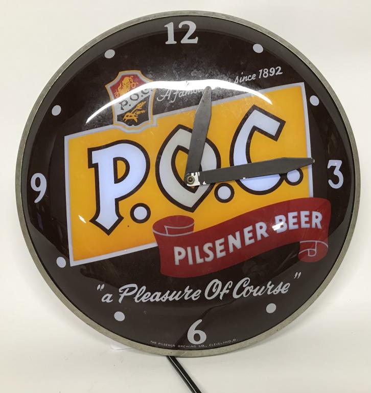 VINTAGE LIGHTED P.O.C. PILSNER BEER CLOCK: Glass front light up advertising clock made for P.O.C. beer, Cleveland, Ohio. worked when tested. 14 1/2" diamter. Very Good-Excellent