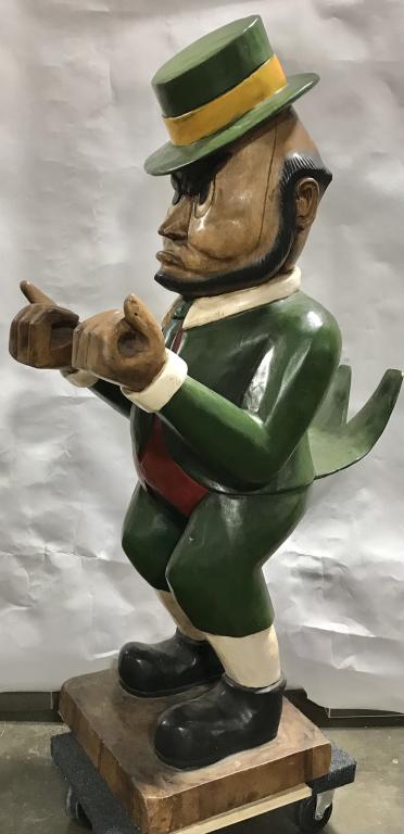 NOTRE DAME FIGHTING IRISH CARVED WOOD MASCOT: Well carved large wood mascot of Notre Dame Fighting Irish. Measures about 50" tall , and 28" at its widest. Nicely carved and painted. Has chipping to coat tails. Nice display for man cave or restaur