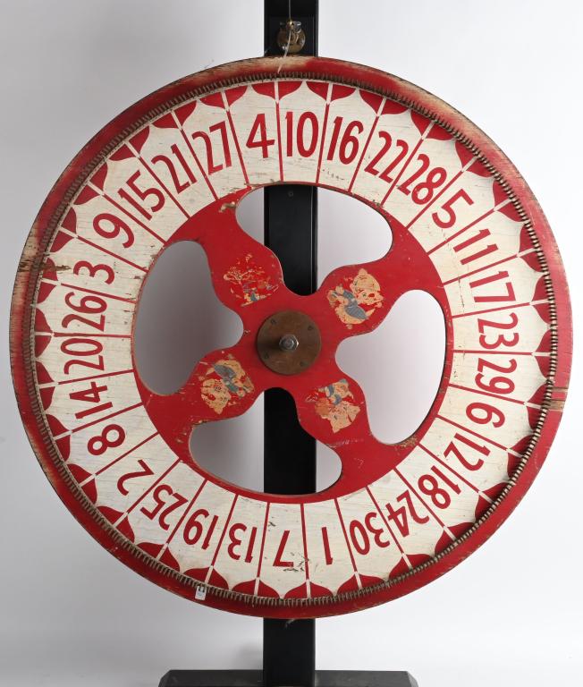 VINTAGE CARNIVAL NUMBERS WHEEL: painted wood wheel measures 35" diameter and stand is about 50" high. Wheel is vintage and has some paint chipping. The stand is contemporary. Wroked when tested. Nice display for man cave or resturan