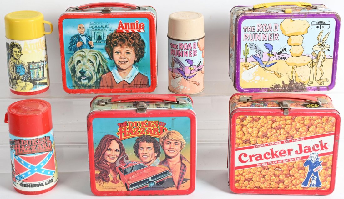 4- VINTAGE LUNCH BOXES: Lot includes Cracker Jack, 1981 Annie with thermos, 1980 Ducks of Hazard with thermos, and 1973 Roadrunner with thermos. Condition varies, All have paint wear. Good-Very Good