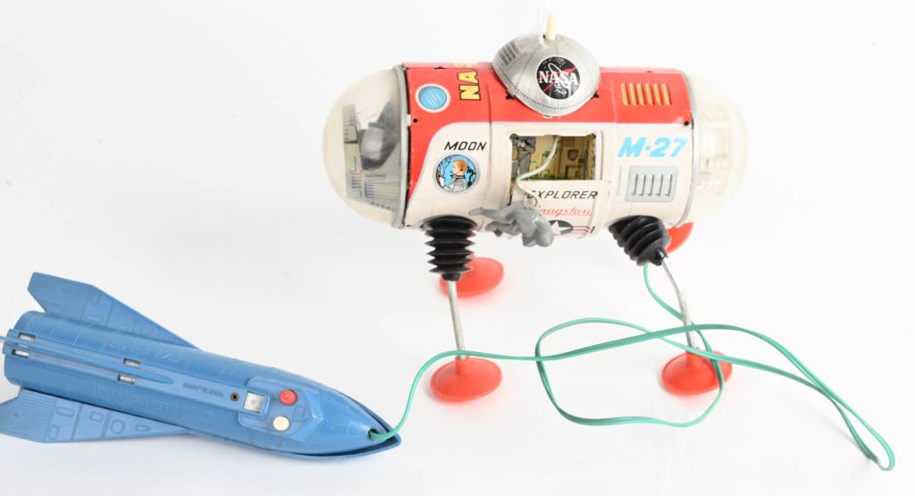 JAPAN BATTERY OP EXPLORER M-27: All original with nice design and graphics. Has Astronaut figure. Has original Rocket Remote Control. Antenna present but broken. Did not work when tested. One leg loose. 9" Very Good