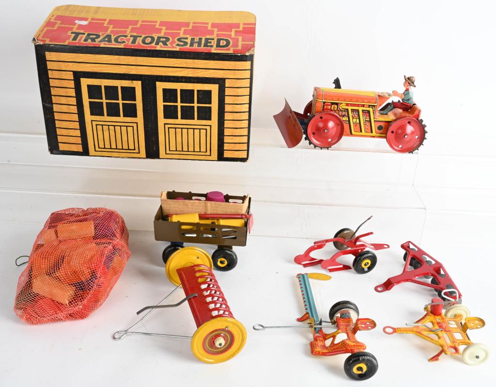 MARX TRACTOR SHED w/ WINDUP TRACTOR & ACCESSORIES: Includes windup Climbing Tractor and many Accessories. Tractor works but treads are broke. Comes in Tractor Shed Box. 13" Very Good-Excellent
