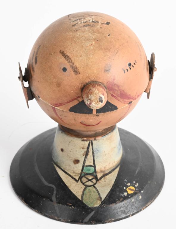 OPENING MOUTH BALD MAN ASH TRAY: Unusual tin ashtray of bald man in suit that opens mouth for the ashes. 5" Excellent