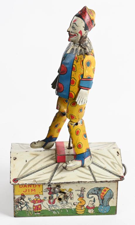 UNIQUE ART TIN WINDUP DANDY JIM THE CLOWN: Unique Art tin windup Dandy Jim the Clown. Nice original example with colorful Clown. Windup works. 10" Excellent