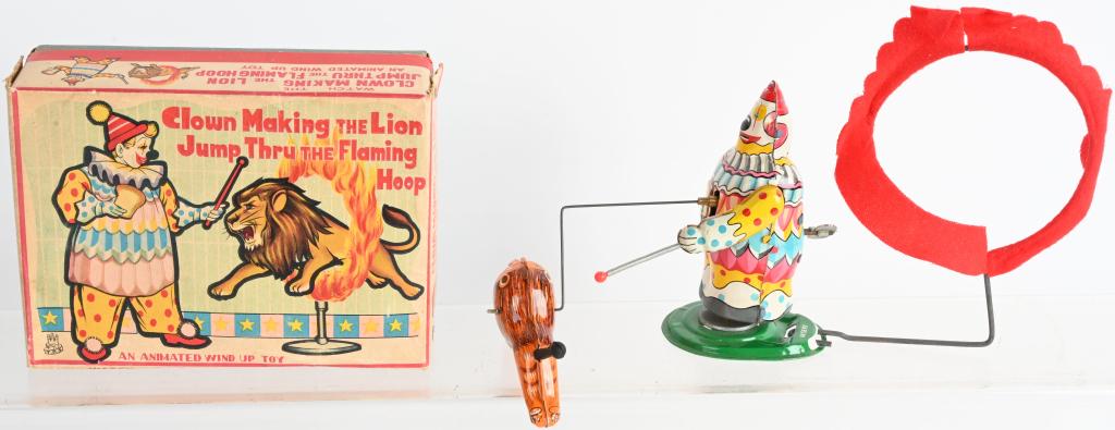 TPS TIN WINDUP CLOWN & LION CIRCUS TOY w/ BOX: All original and complete. Great colors. Windup works. Boxed 6 1/2" Excellent
