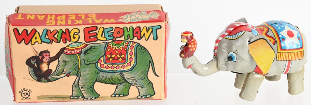 JAPAN TIN WINDUP WALKING ELEPHANT w/ BOX: All original tin windup Elephant with Monkey in its truck. Works. Boxed 6" Excellent