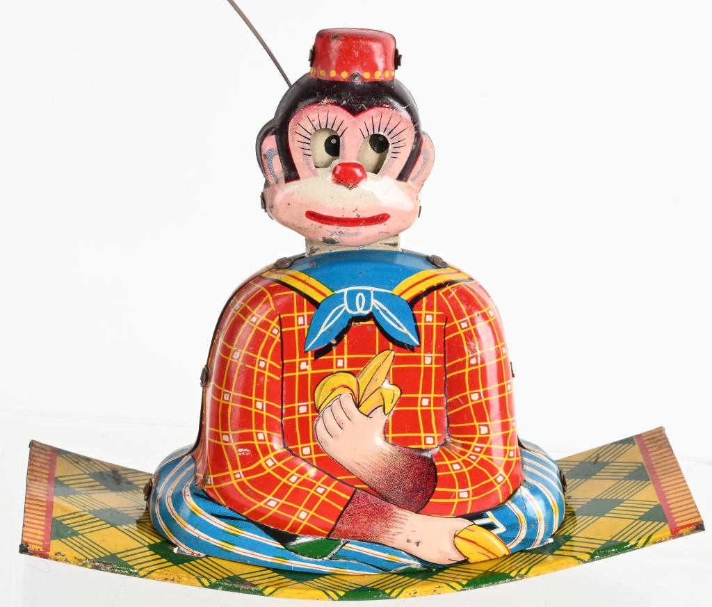 JAPAN TIN WINDUP SWINGING MONKEYS: All original Monkey on rocker with Monkey swing over top. Works. 9" Excellent