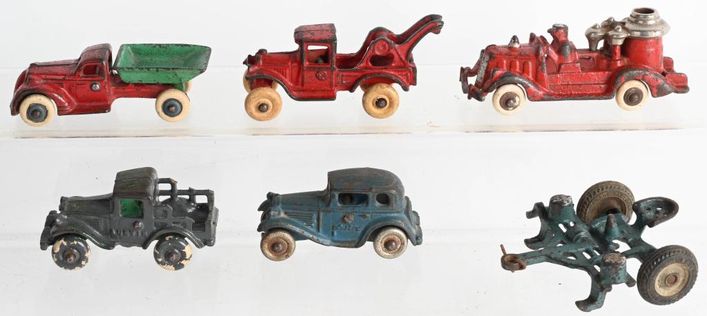 6- CAST IRON TOY VEHICLES: Lot includes nice original Arcade 4" Wrecker Tow Truck and Dump Truck, Arcade Tractor Implement, 2 Austin Vehicles and a 5" Hubley pumper. Some condition issues on Austins, the rest have no cracks or 