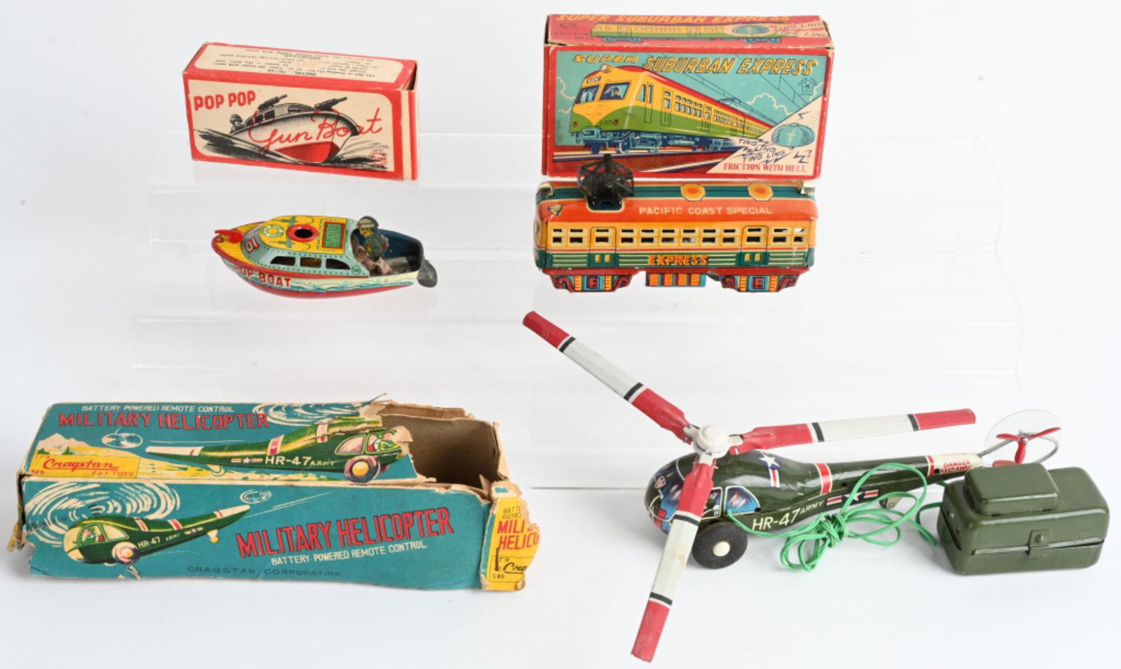 3- JAPAN TIN TOYS w/ BOXES: Includes Suburban Express Train, Battery Op Military Helicopter, and Pop Pop Gun Boat. All Boxed. Largest 8" Excellent