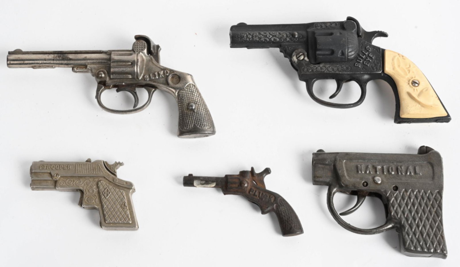 5- VINTAGE CAST IRON CAP GUNS: Includes National, Sliko, Trooper, Bulls Eye, and Pluck. All original. Largest 7" Very Good-Excellent