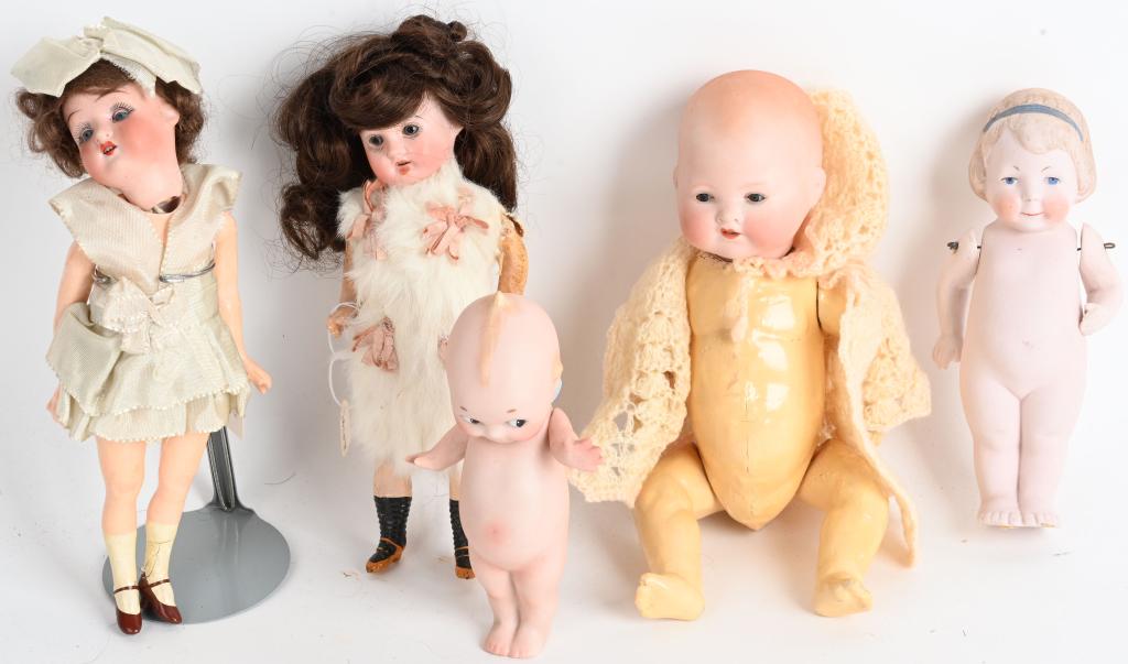 5- VINTAGE BISQUE DOLLS: Lot includes a 8" Recknagel doll with bisque head, a 9" Armand Marseille baby doll with sleep eyes, a 6" Kewpie doll, a 6 1/2" doll with moving arms, and a 9" Heubach doll with bisque head and sleep e