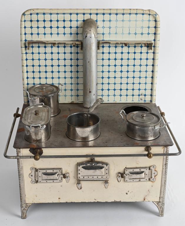 VINTAGE TIN GERMAN STOVE: Early tin stove measures 16" by 14". Complete except for one pot. Has two alcohol burners. Very Good-Excellent