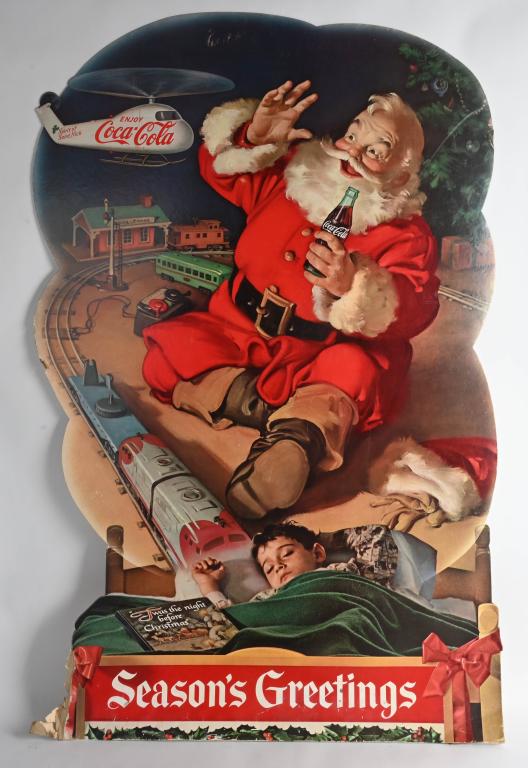 VINTAGE SANTA CLAUS COCA COLA & TRAINS SIGN: Nice looking original sign depicting Santa Claus drinking a Coca Cola surrounded by toy trains. Some damage at bottom. 48" by 30", Good