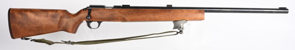 U S MARKED H&R MODEL M12 .22 TARGET RIFLE: SERIAL NUMBER AX521630. BARREL 28". CALIBER .22 LONG RIFLE. 1980'S Era US marked military training rifle. Bolt action, single shot, heavy round barrel with three scope blocks and receiver sight base b