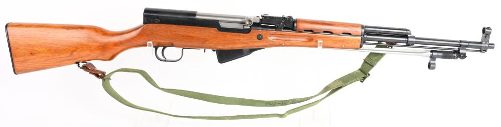 NORINCO CHINESE SKS RIFLE WITH SPIKE BAYONET.: SERIAL NUMBER 10-1827112 BARREL 20" CALIBER 7.62X39 MANUFACTURED 1980'S. Produced in china for commercial sale in the United States. Deep gloss blue finished steel with lacquered Chinese hardwood stoc
