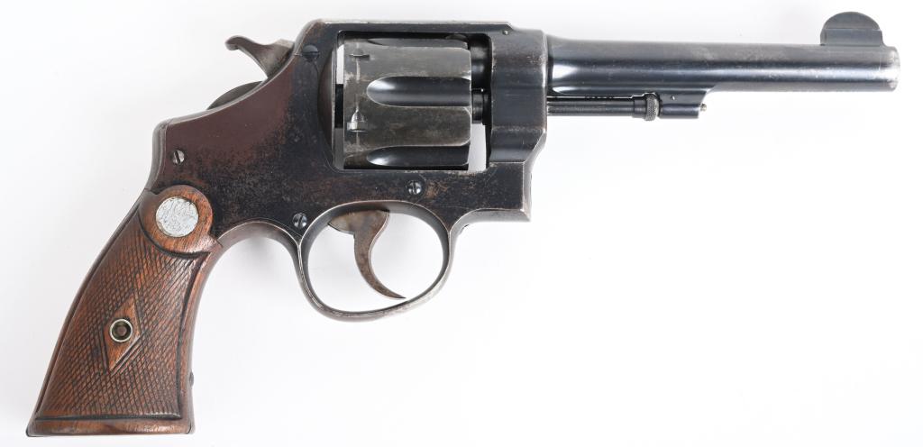SMITH & WESSON US MODEL 1917 REVOLVER: SERIAL 154283. BARREL 5.5". CALIBER .45 ACP. This example has the United States Property under barrel with flaming bomb on left side of frame and eagle head inspector stamp under barrel and back of cy
