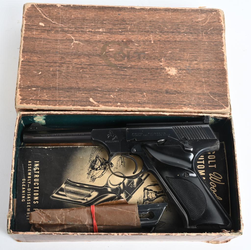 BOXED COLT WOODSMAN SPORT SEMI AUTO PISTOL: SERIAL 171587-S. BARREL 4.5". CALIBER .22 LONG RIFLE. MADE IN 1957. Quality semi auto features high polish factory blue finish, target rear sight, Colt logo black plastic grips and one original magazi