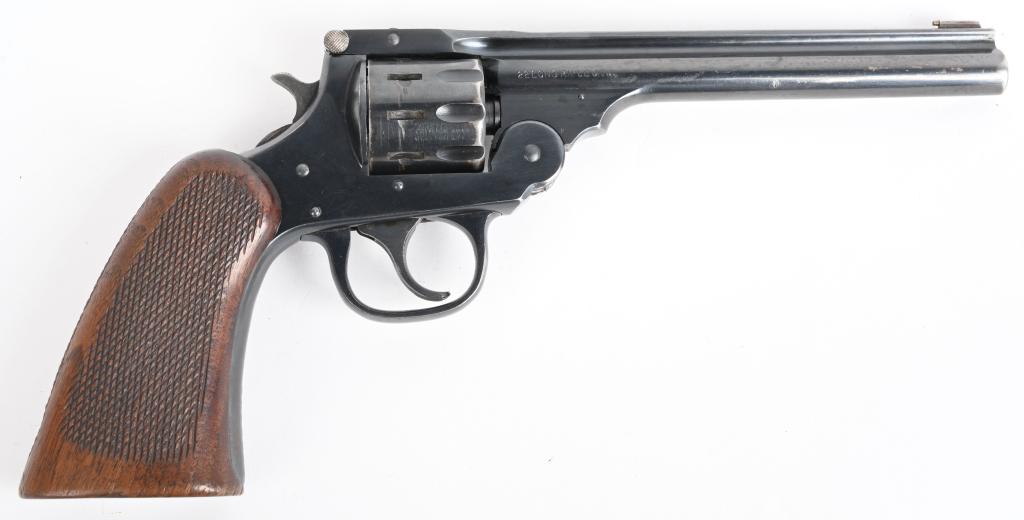 PRE WAR H&R "22 SPECIAL" TOP BREAK TARGET REVOLVER: SERIAL 603546. BARREL 6". CALIBER .22 LONG RIFLE. Nine shot , double action, blue finish, top break with large factory original one piece checkered walnut grips. Some thinning on muzzle and high edges