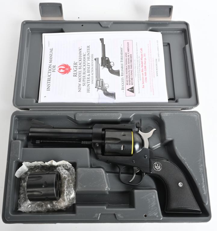 BOXED RUGER NEW MODEL .357 BLACKHAWK REVOLVER: SERIAL 38-84328. BARREL 4 3/4". CALIBER .357 MAGNUM. Classic six shot single action with factory blue finish, target rear sight and replaced old style black plastic grips. Gun has been fired but still