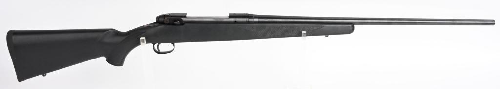 LH SAVAGE MODEL III BOLT ACTION .300 MAG RIFLE: SERIAL F667485. BARREL 24". CALIBER .300 WIN MAG. Great no frills quality hunting gun that features a blue finish, checkered pistol grip nylon stock with pad & eyes, no barrel sights and tapped for sc