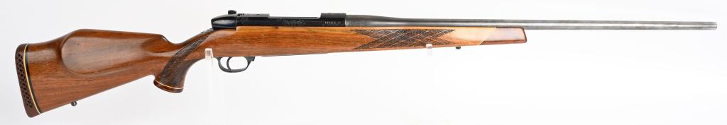 LH GERMAN WEATHERBY MARK V RIFLE: SERIAL P37176. BARREL 24". CALIBER 7MM MAGNUM. Features typical skip checkered pistol grip stock with Monte Carlo comb and red waffle pad with Rosewood grip cap & fore-end top and sling eyes. Barrel i