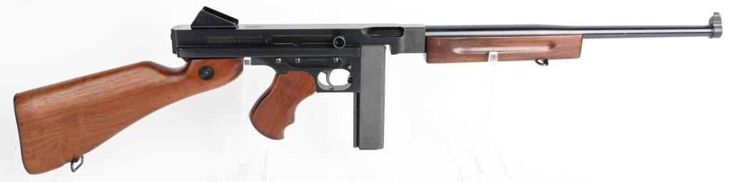 CASED THOMPSON SEMI AUTOMATIC CARBINE: SERIAL 16016. BARREL 17". CALIBER .45 ACP. Semi-automatic version of the famous Tommy Gun. Blue finish with walnut fore-end, pistol grip and stock. Gun has seen light use. There are couple of handling