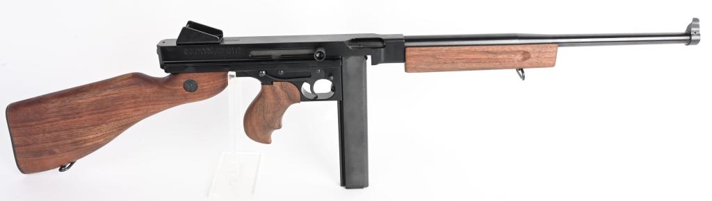 CASED THOMPSON SEMI AUTOMATIC CARBINE: SERIAL KG2738. BARREL 17". CALIBER .45ACP. Semi-automatic version of the famous Tommy Gun. Blue finish with walnut fore-end, pistol grip and stock. Gun appears to have no use sans minor handling marks