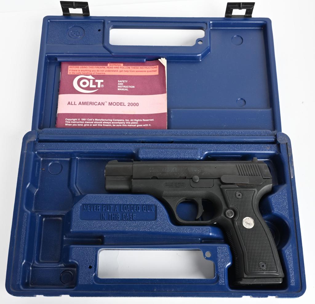 CASED COLT MODEL 2000 ALL AMERICAN SEMI AUTO: SERIAL PF02077. BARREL 4.5". CALIBER 9MM. Features alloy frame, blue finish, double action, white dot combat sights, black composition grips and one 15 round magazine. As new. M
