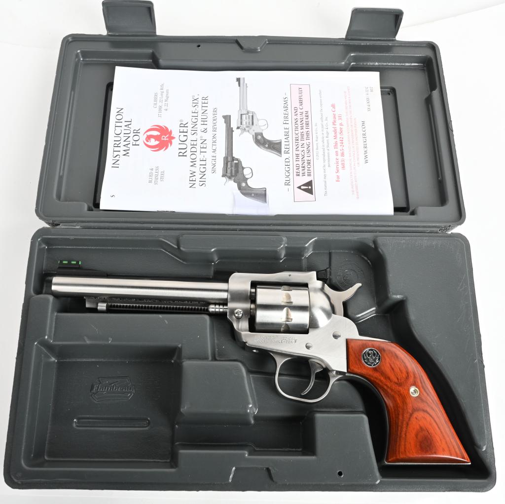 BOXED RUGER STAINLESS MODEL SINGLE TEN .22: SERIAL 810-13010. BARREL 5.5". Caliber .22 RIMFIRE. Newly introduced is this fantastic 10 shot .22 long rifle stainless single action Ruger with target rear sight, luminescent front sight with wood gr