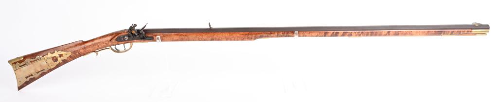 SIGNED CUSTOM FULL STOCK FLINTLOCK KY RIFLE: BARREL 42". CALIBER . 40. This beauty was hand built by J.P. McCoy and is stamped on top of full browning octagon barrel. Features include a full length maple stock, leaf rear sight, knife front sight