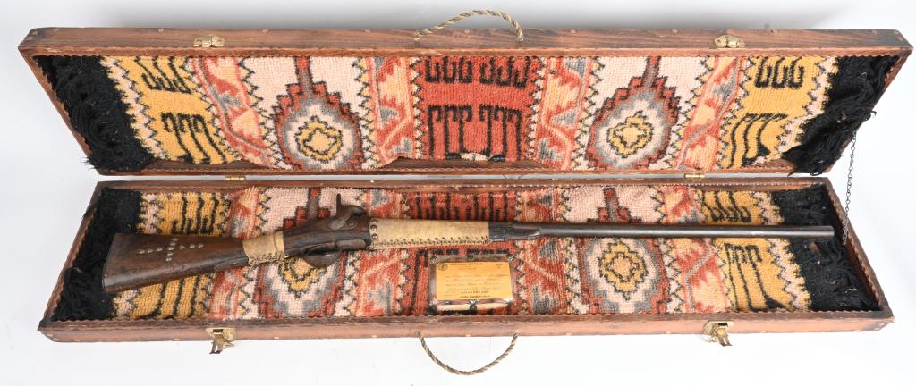 EARLY 19TH CENTURY INDIAN TACKED TRADE MUSKET: According to the accompanying document, this rifle was located at a museum in Minnesota. It appears to be a European military type musket with stock cut down, leather wrapped with brass tack decoratio