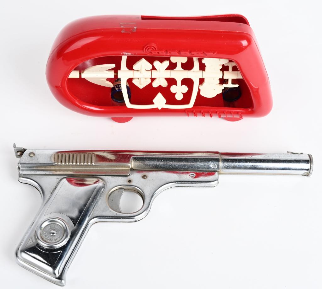 DAISY NO 118 TARGETEER PISTOL & TARGET REST: DAISY TARGETEER Set NO. 320 with No 118 Pistol. SHOOTING GALLERY SET OF SPINNING TARGETS AND MOLDED PLASTIC TRAP. Gun is finished in factory nickel. MANUFACTURED and offered as a set from 1949 TO 1952