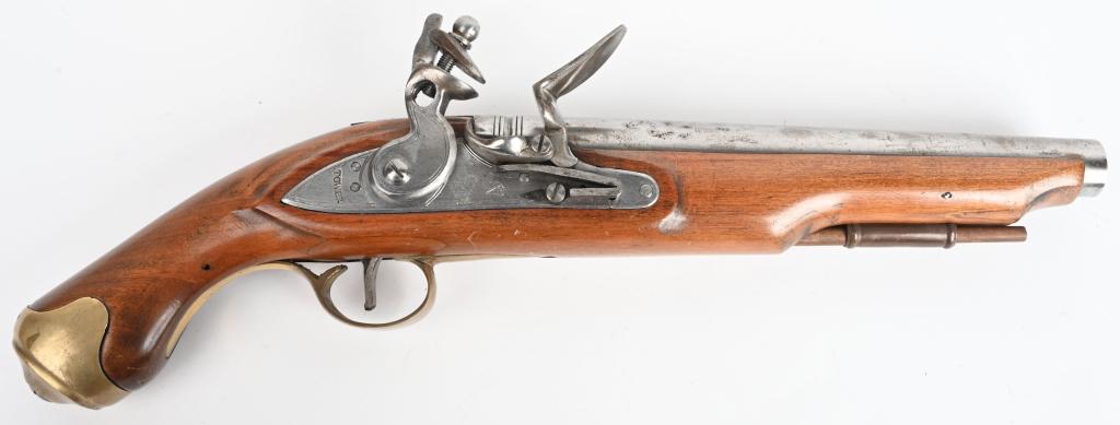 REPRODUCTION BRITISH TOWER FLINT PISTOL.: SERIAL NUMBER 7258 BARREL 9" CALIBER 67 SMOOTH BORE. MANUFACTURE , JAPAN. A Bright steel barrel with bright steel flint lock marked with British Crown and marked TOWER at rear. One piece varnished woo