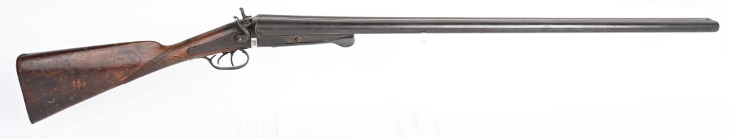 ANTIQUE UNDER LEVER 12 BORE SXS SHOTGUN: Appears to be complete. No visible maker name. Metal dark patina. Stock could be refinished nicely. As is decoration or parts. A
