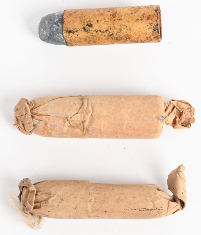LOT (3) PAPER CIVIL WAR CARTRIDGES: A. Completely enclosed in paper, string tied with folded tab, measures .520 and 2 3/8" B. Cardboard type case with .570 flat lead bullet and measures 1 7/8". C. Completely enclosed paper cartridge wit