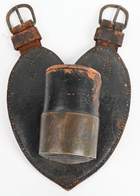 CIVIL WAR FLAG BEARER FLAG POLE HOLDER W TAG CW: Civil War Heart Shaped Flag Holder measuring 9 inches tall including the brass buckles. The cup measures two inches wide X 3 1/2 inches deep and has a reinforced wood bottom with brass ring. To the re
