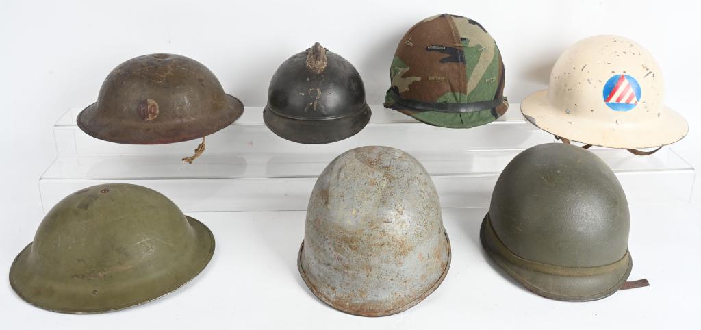 WW1 & WWII US & FRENCH HELMET LOT OF 7 HELMETS WW2: Large Military helmet lot to include 1) WWII Civil Defense Helmet complete with Liner 2) 1942 dated British or Canadian helmet with liner but missing the chinstrap 3) US Navy Vietnam era M1 helmet wit