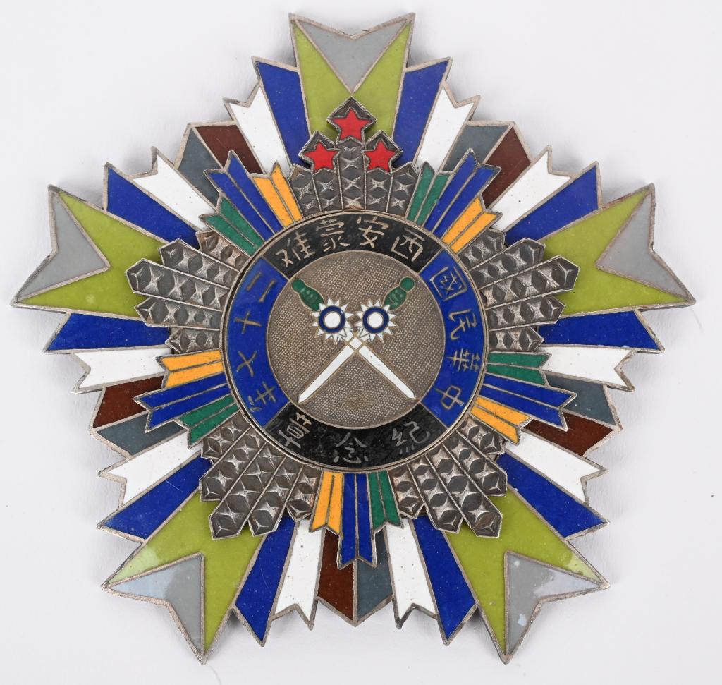 CHINESE KUOMINTANG COMBAT BREAST BADGE ORDER : Approximately 2.5" x 2.5" with a pair of downward-pointing swords, each of which have the KMT star at the crossguard and alternating green, white, blue, red, and yellow beams and three red stars. Th