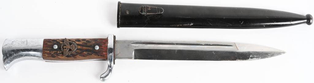 WWII NAZI GERMAN STAG HANDLED POLICE DRESS BAYONET: The hilt of this example looks to have all of the original plating intact. The wood faux stag plates are in excellent condition with two alloy rivets holding them in place. to the obverse a bronzed al