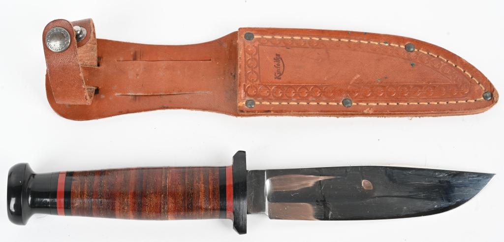 US WWII ERA KINFOLKS KNIFE AND SHEATH MINT WW2: Bright finished six inch blade, with a nice stacked leather grip and black Bakelite, pommel and guard. The blade is clean, displaying no age or wear, with clear Kinfolks markings on the ricasso. Sound