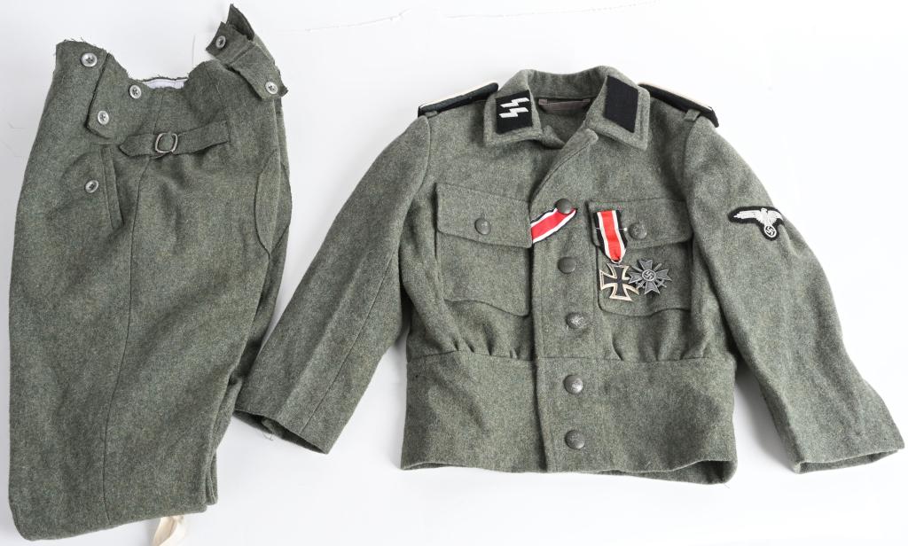 REPRO WWII NAZI GERMAN WAFFEN SS CHILD'S UNIFORM: Repro WWII Nazi German Waffen SS child's sized uniform complete with trousers and medals. Small M44 child's uniform with SS sleeve eagle, SS Infantry Shoulder Boards, SS bullion Runic tab and a blank 