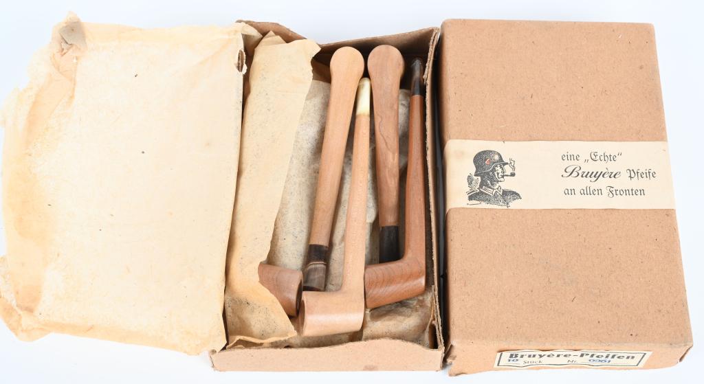 WWII NAZI GERMAN CASED SET OF 10 WOODEN PIPES WW2: WWII Nazi German cased small wooden personal pipes. The label reads "eine Echte Bruyere Pfeife an allen Fronten" which translates to "a real briar pipe on all fronts". Having a Wehrmacht soldier smoki