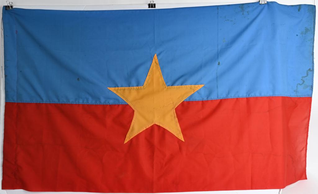 ORIGINAL VIETNAM VIET CONG SILK FLAG: Original Viet Cong Flag. 32” x 58”. Displays from both sides with cut out center star with minor staining but otherwise excellent. The Vi?t C?ng, also known as the National Liberation Front of Sou
