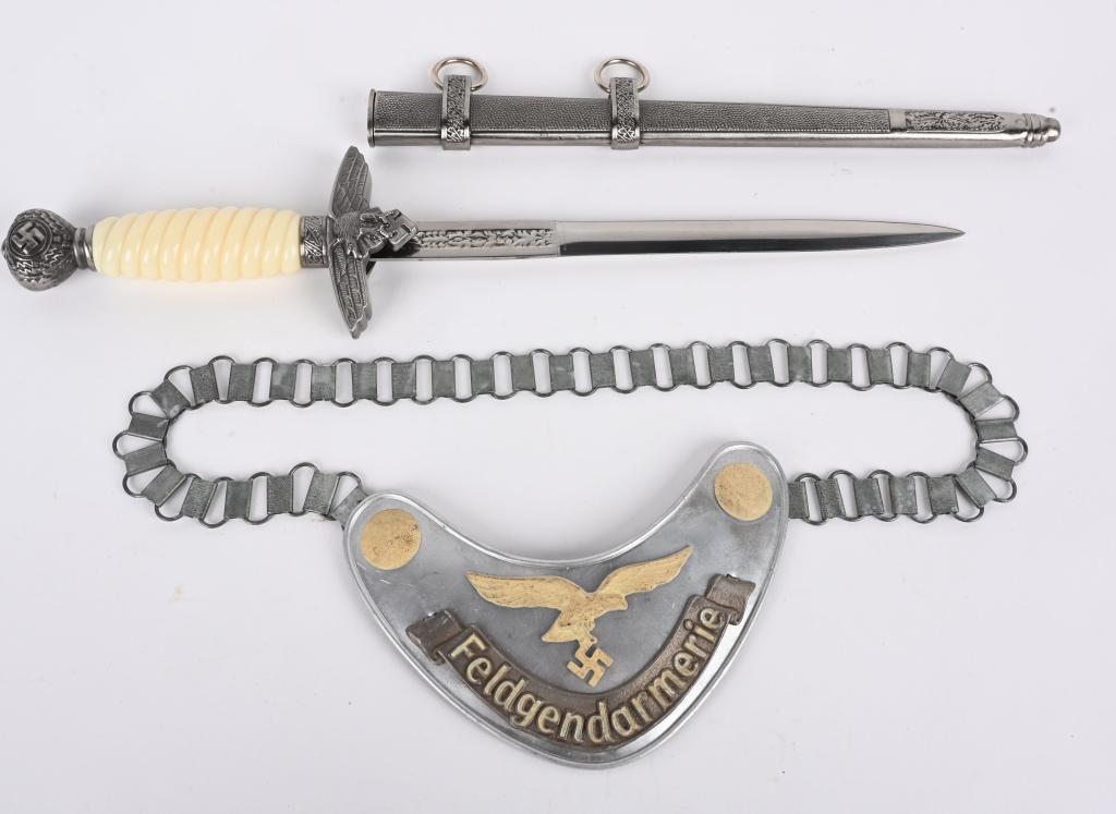REPRO WWII NAZI GERMAN LUFTWAFFE DAGGER & GORGET: REPRO Nazi German Luftwaffe items to include 1) German Luftwaffe Feldgendarmerie Gorget. The gorget is in excellent condition. Still the remains of the cloth backing. The gorget is for the luftwaffe a
