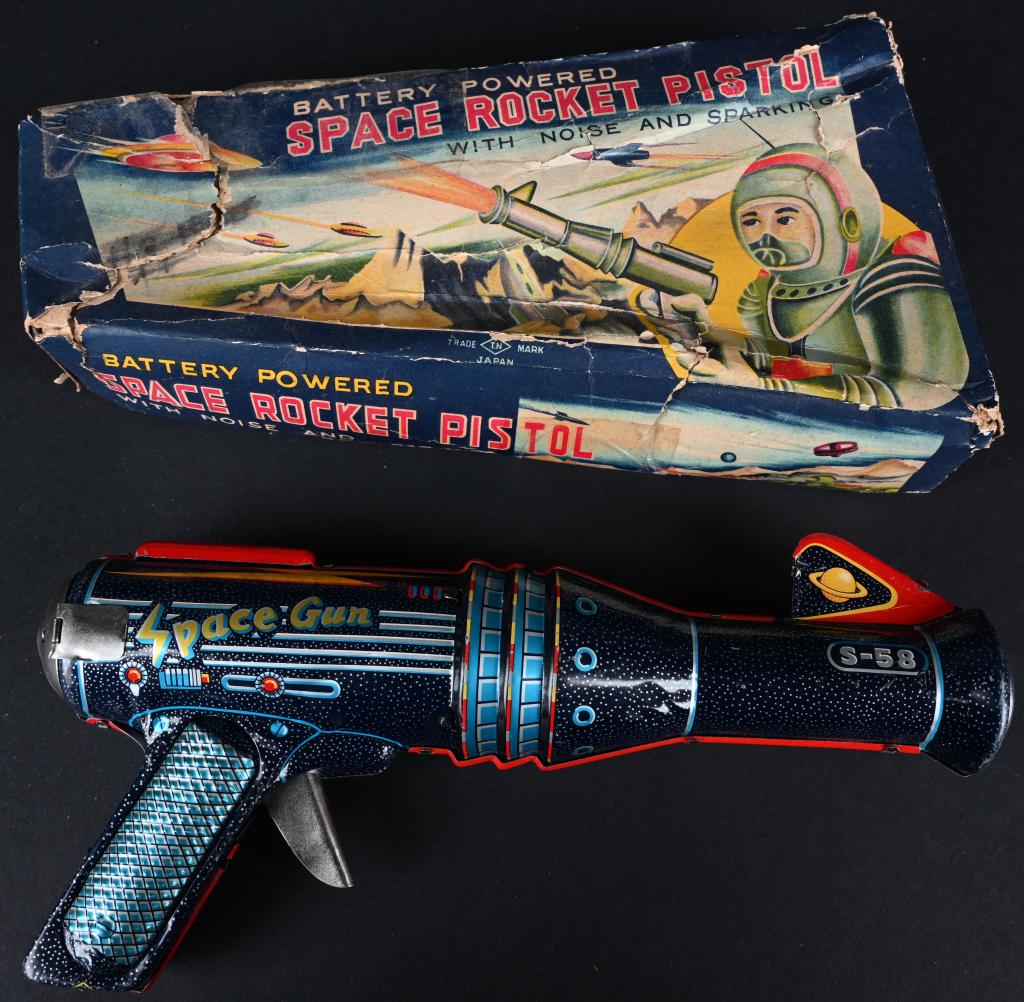 TN BATTERY OP SPACE ROCKET PISTOL w/ BOX: Nomura battery operated Space Rocket Pistol. Made in Japan. All original and complete. Did not work when tested. Comes with box with tape and wear. 9 3/4" Excellent