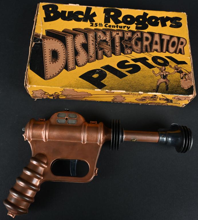 DAISY BUCK ROGERS DISINTEGRATOR PISTOL w/ BOX: Daisy Buck Rogers Disintegrator Pistol. Made in the USA. Copper finish version. All original and complete. Pop action still works. Comes with scarce original box with tape secured end flaps. 10" Excel